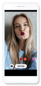 Photo of a smartphone with a woman pursuing her lips to try on different shades of lipstick in an example of augmented reality on smartphones.