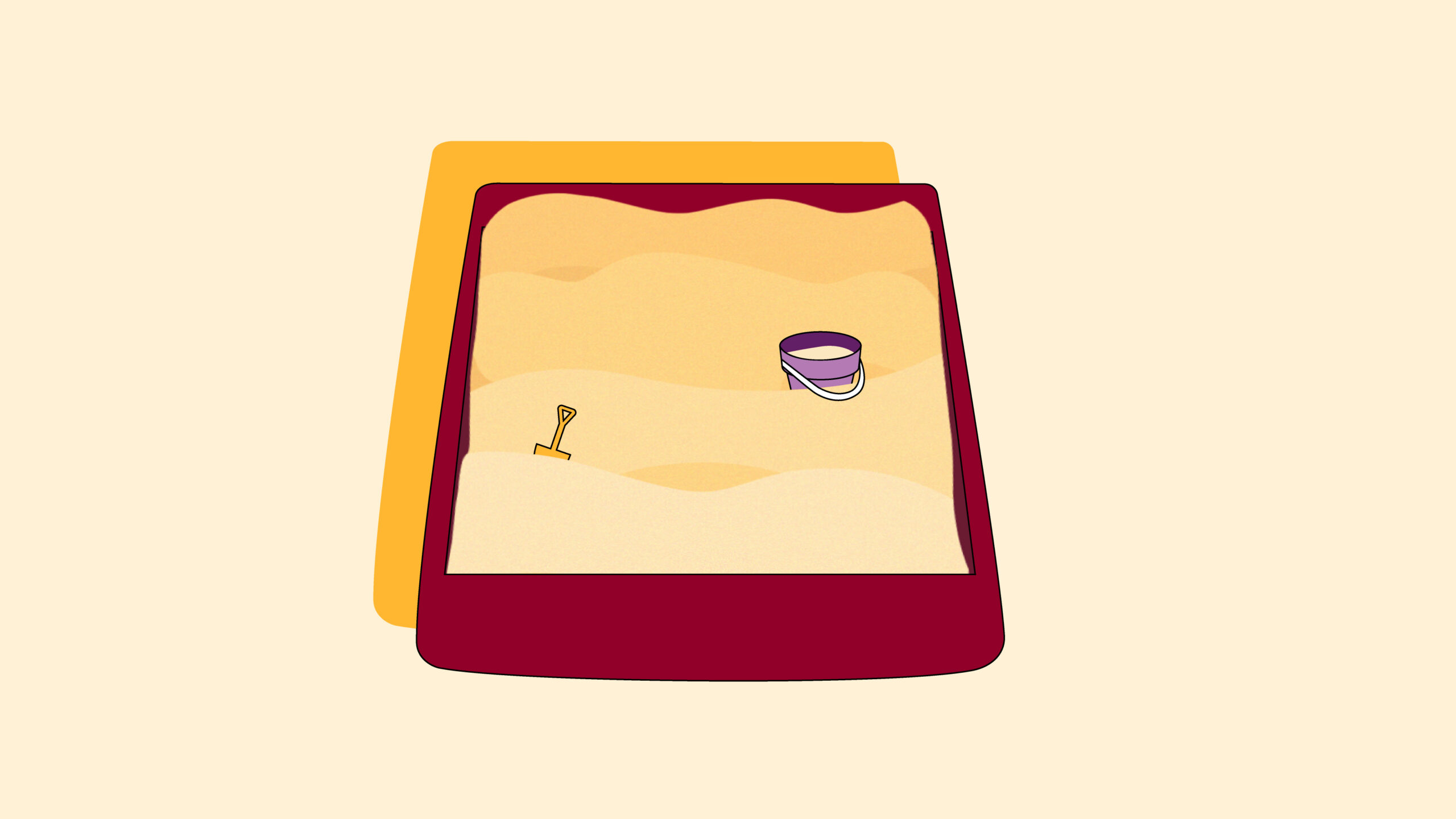 A sandbox with a small shovel and bucket resting on the sand.